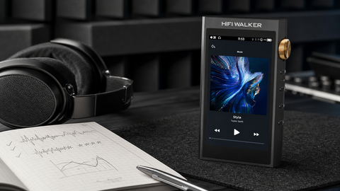 HIFI WALKER H20 Ultra with over-ear headphones and listening notes on a desk.