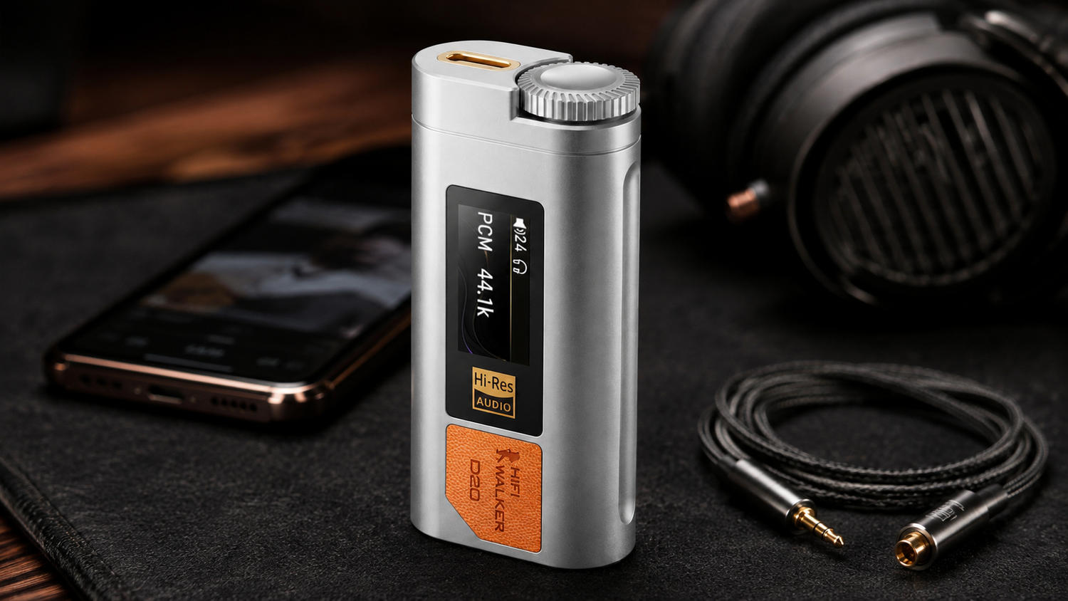 HIFI WALKER D20 USB-C DAC with its silver dial and orange panel beside a smartphone and wired headphones.