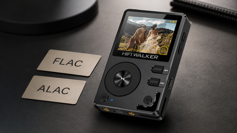 HIFI WALKER H2 music player beside two cards labeled FLAC and ALAC on a dark tabletop.